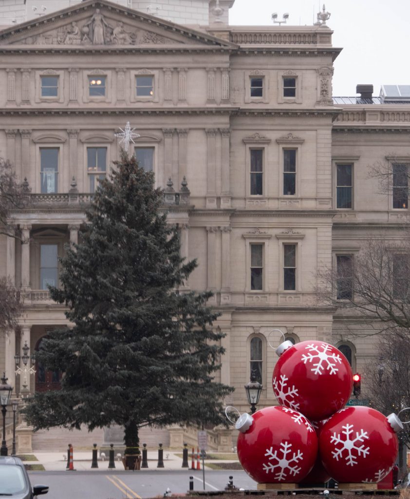 State Holiday tree and three oversized ordainments.
