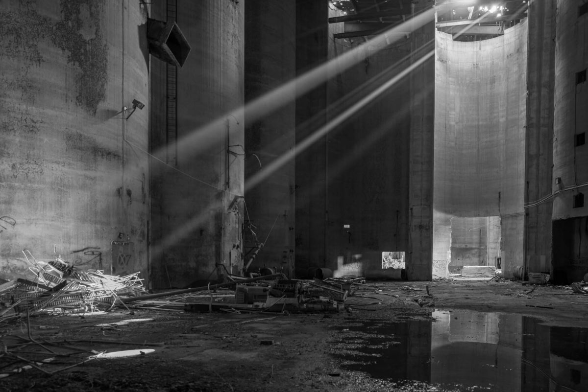 Beams of light in dark empty warehouse