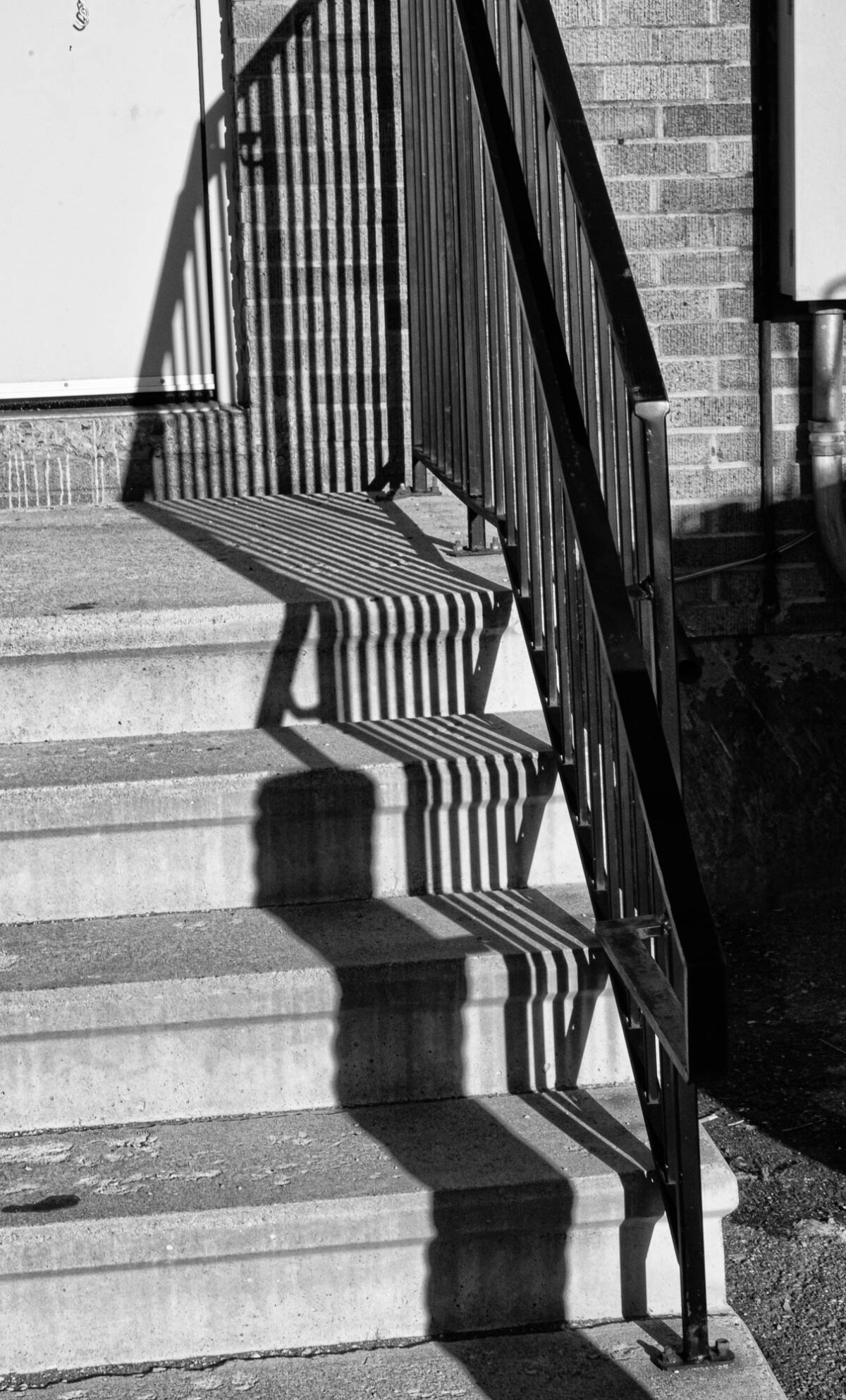 Stairs with the shadow of handrails.
